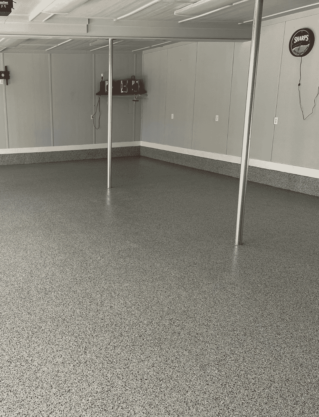Austin TX Epoxy Garage Floor Speckled gray epoxy flake coating on a garage floor.